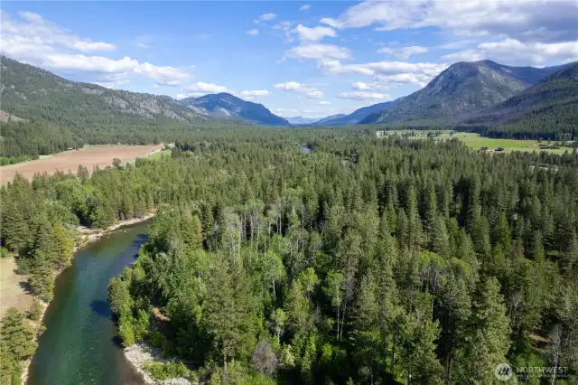Towering mountain views from the shared riverfront. Common area preserves natural landscape and open space. Environmentally conscious community with thoughtful design standards