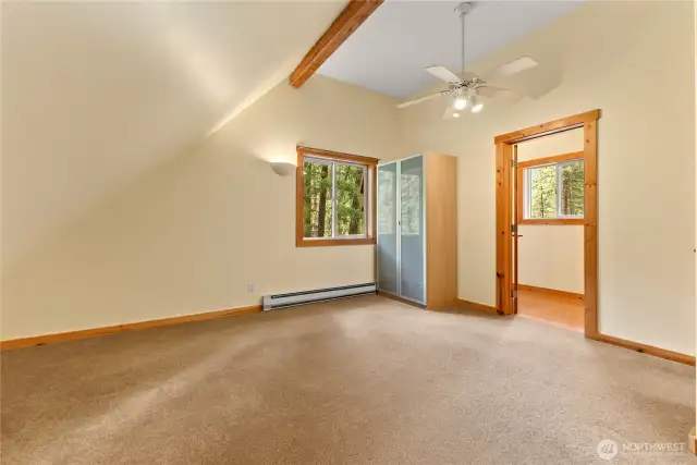 Upstairs primary bedroom with private half bath