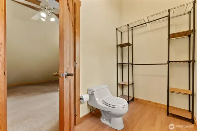 Spacious half bathroom with potential to add a shower and create a full bath.