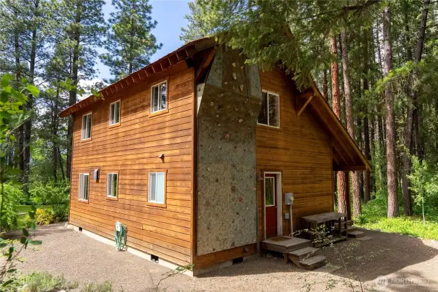 Unique custom-built climbing wall integrated into the home’s exterior—perfect for fitness enthusiasts and adventurous spirits