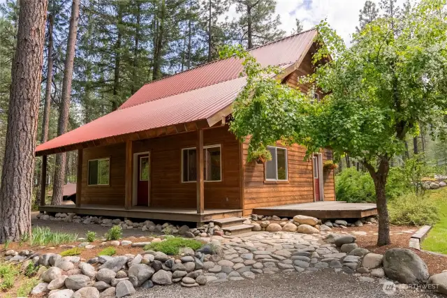 Gravel driveway with ample parking space  Room to add garage or storage shed if desired