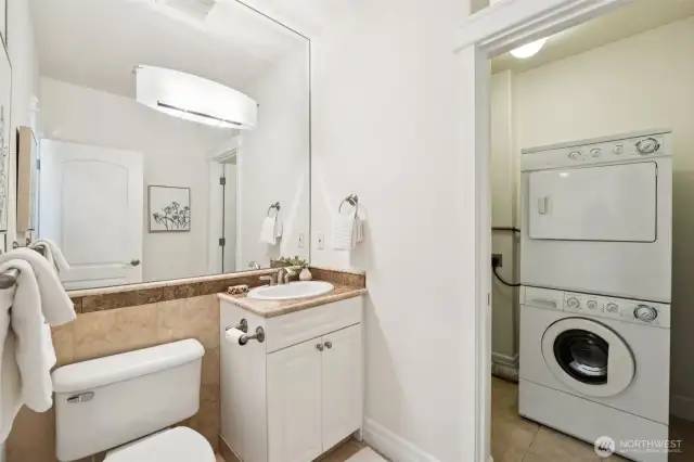 Stylish 1/2 bath on main is adjoined with the in unit laundry room