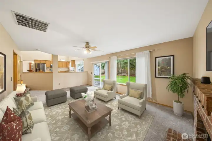 Family room looking back at kitchen. (virtually staged)