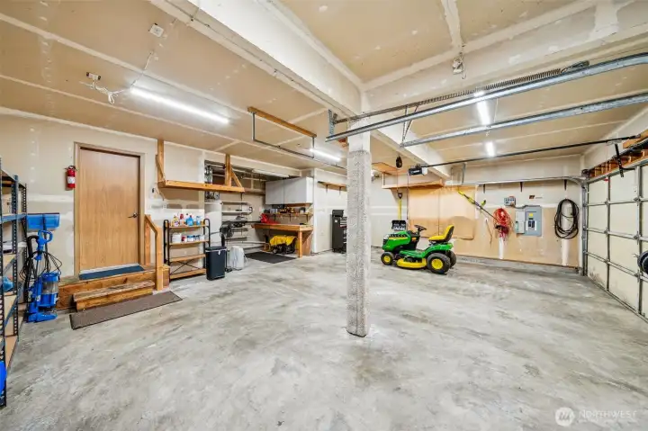 3 car garage with shop area. Riding mower is negotiable.