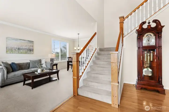 The elegant staircase makes a statement with vaulted ceilings leading to all 4 bedrooms + bonus room.