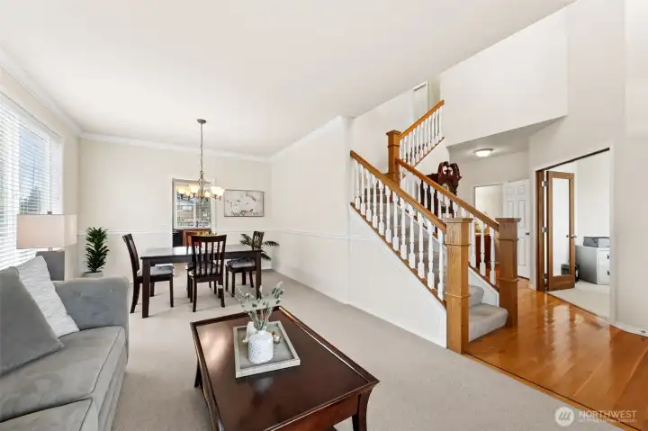 Formal living and dining rooms feature elegant crown molding and chair rail detailing, creating a space that feels both comfortable and refined. This home has been exceptionally well cared for and feels barely lived in.