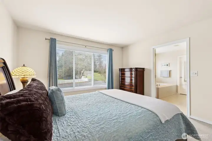 Primary suite with double door entry into the attached 5 piece bathroom.