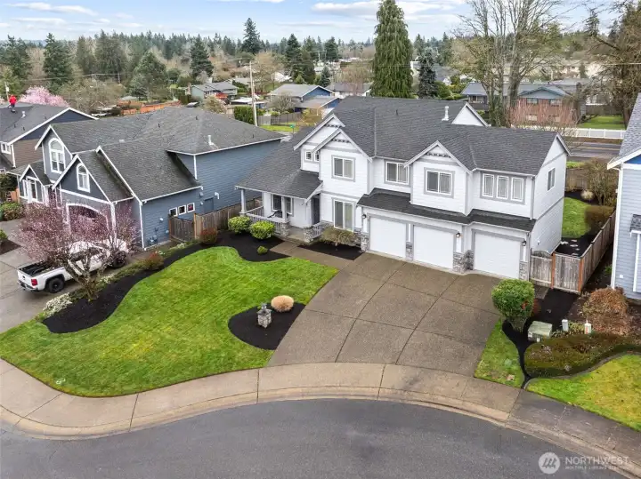 Large driveway plus three car garage offers lots of different options for parking.