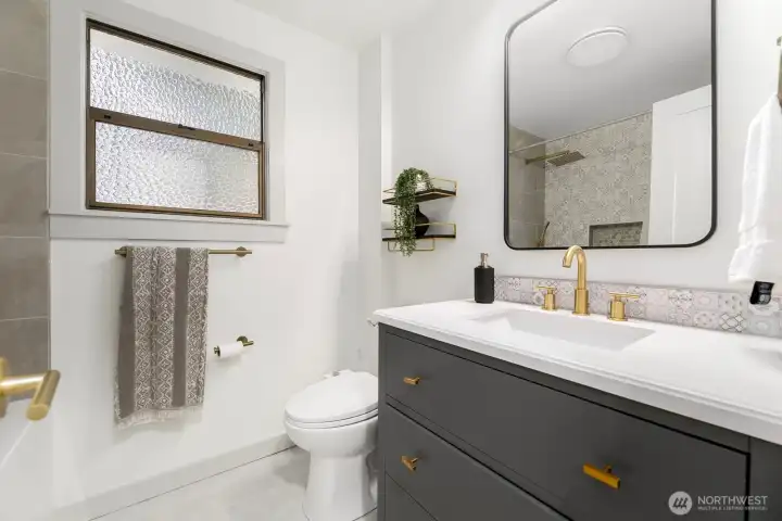 Luxury main floor bathroom with custom cabinets, Italian tile floors and luxury appointments.
