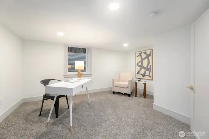 Lower level office with non-conforming ceiling heights perfect for work from hoe option with egress and full closet.