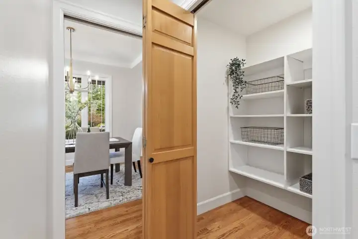 Convenient dining-to-kitchen pass-through with walk-in pantry, offering generous storage for effortless entertaining.