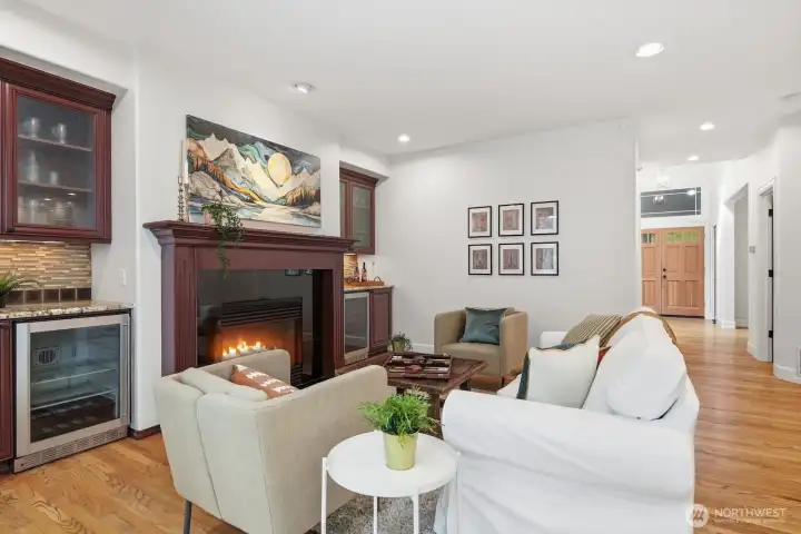 Family room boasts warm custom cabinetry and two built-in beverage and wine fridges.