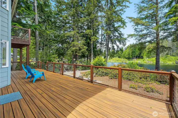 Trex deck wraps around and offers privacy, plenty of seating room, and an oasis.