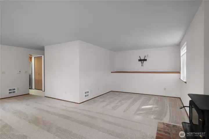 Extended living and family room with built in nook.  Lots of windows give natural light.