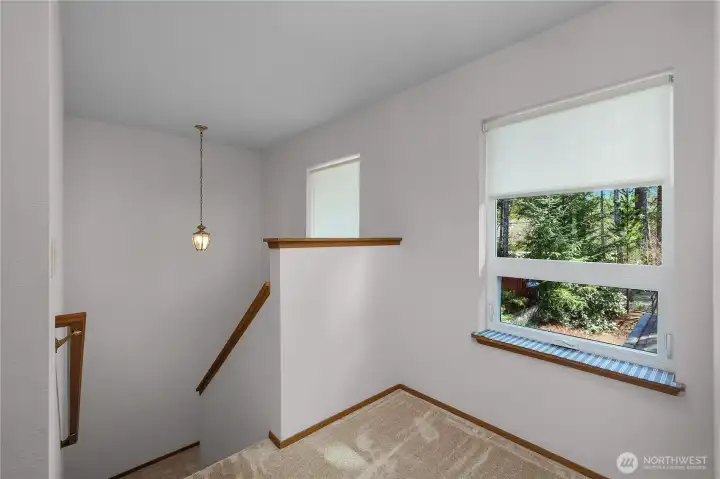Stairs leading you upstairs.  Window looks to the street side.