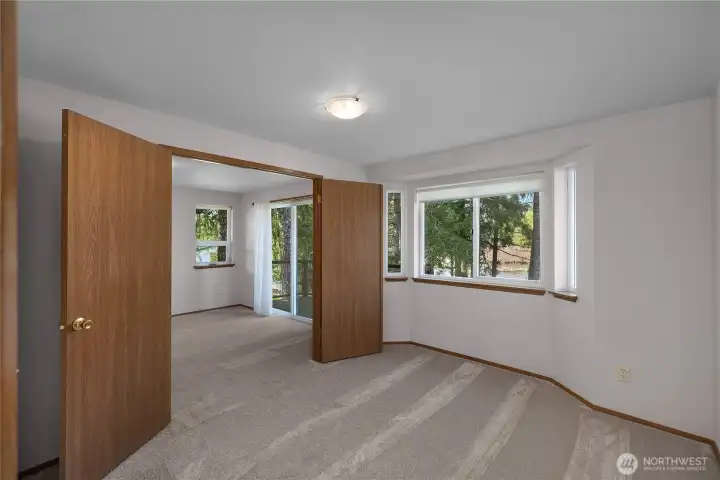 Bedroom 3 opens with french doors to primary room - could be used as an ensuite office?