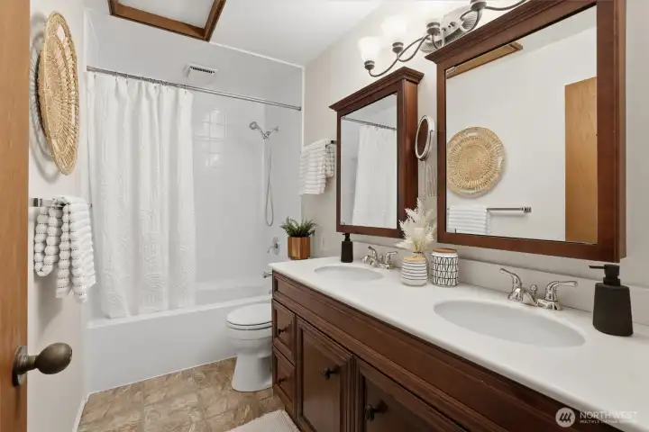 Full bath with double sinks.