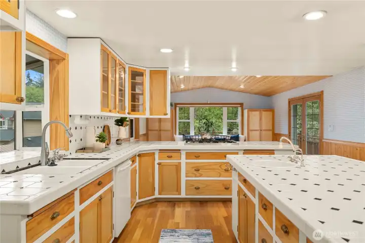 Double oven, six-burner gas stove, warming drawer.