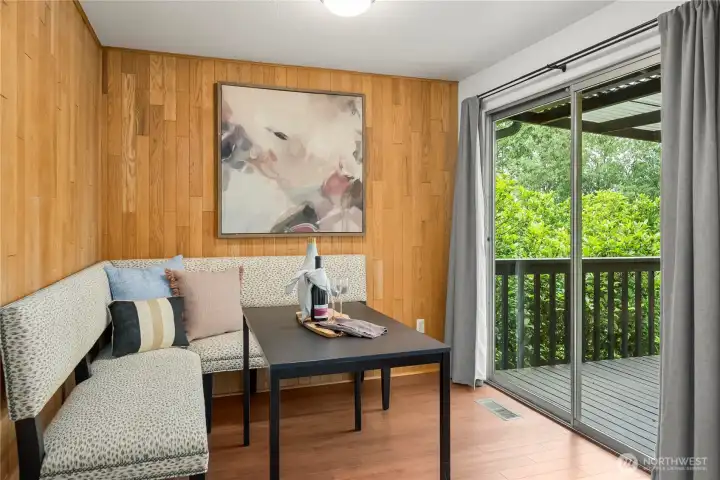 Charming dining area with natural wood accents and outdoor flow Charming dining area with natural wood accents and outdoor flow