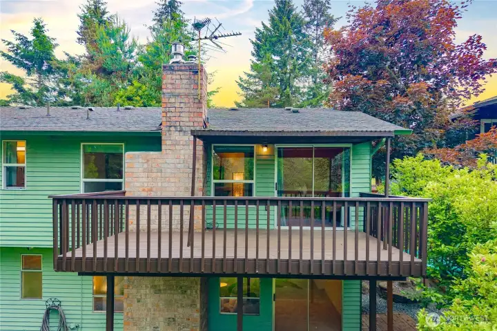 Two outdoor living spaces with upper balcony and covered patio below Two outdoor living spaces with upper balcony and covered patio below