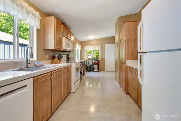 Alley way kitchen leads to the nook and back covered porch.
