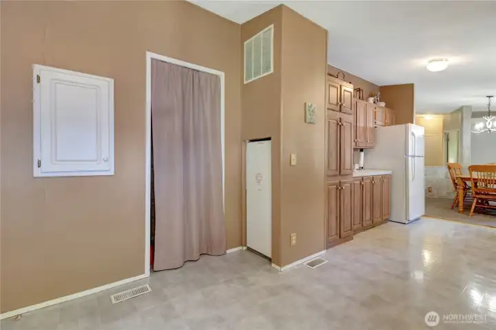 Furnace with washer and dryer access through the curtain. Simple and functional.