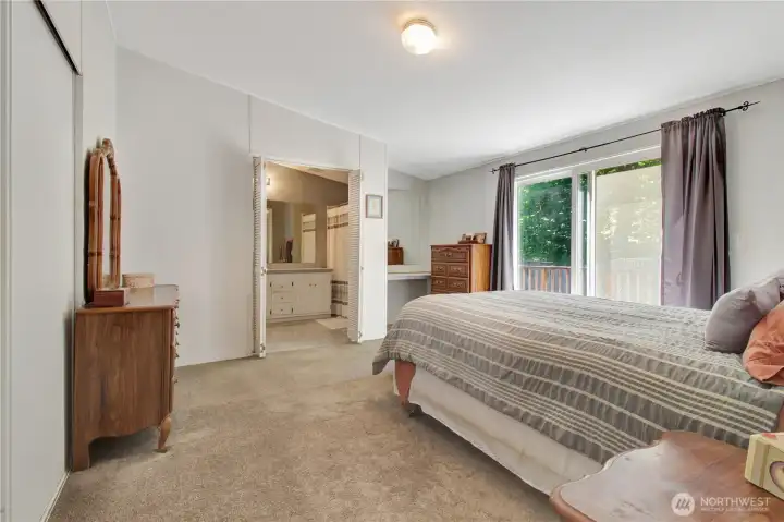 Primary bedroom has access to the back porch with a on suite bathroom.