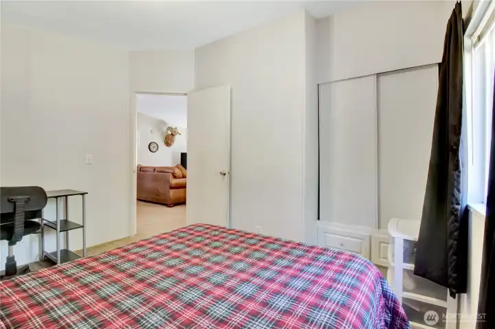 Closet space and entry for this first bedroom.