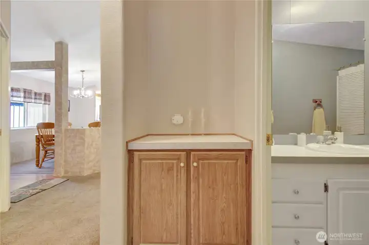 Shared hall cupboard storage and optional study area.