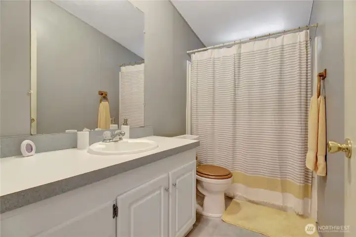 Shared bathroom fully equipped with easy access for guests from the main entertaining area.