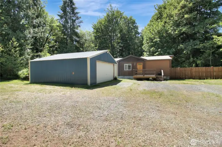 Spacious 24 x 24 shop space with power, and oversized garage door! perfect for any outdoorsman and storage options.