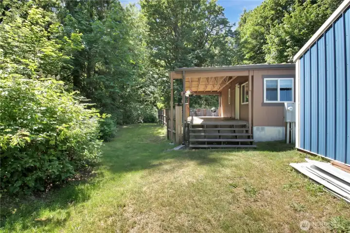 Side yard space with entry to the back covered porch and back yard!