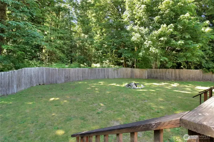 backyard is fully fenced and private! You own the trees!