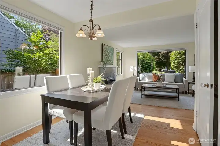 Nice, large dining room with a large window and refinished hardwood floors.