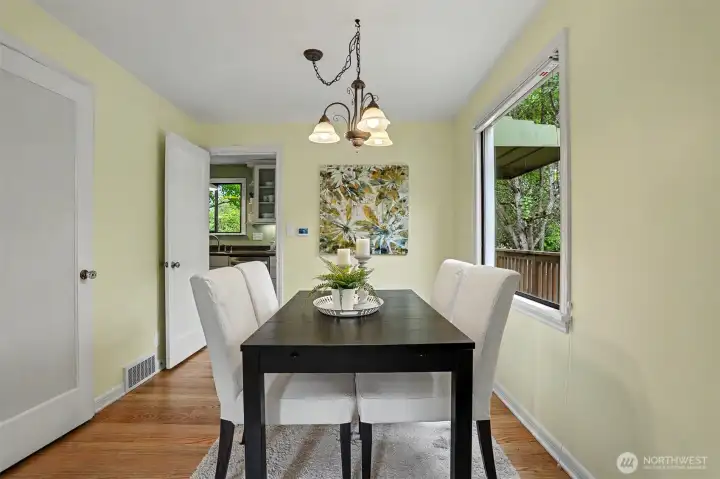 The dining room looking into the kitchen.  The door to the left leads to the lower level.