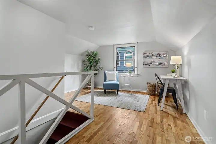 Upstairs is a huge primary suite complete with office or workout nook.
