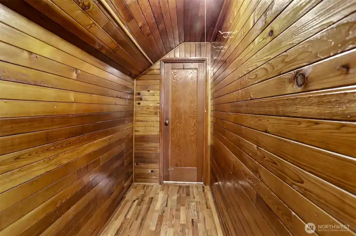 Walk-in closet in the primary bedroom upstairs.