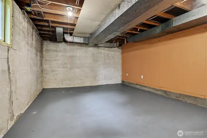 Empty unfinished room in the lower level.