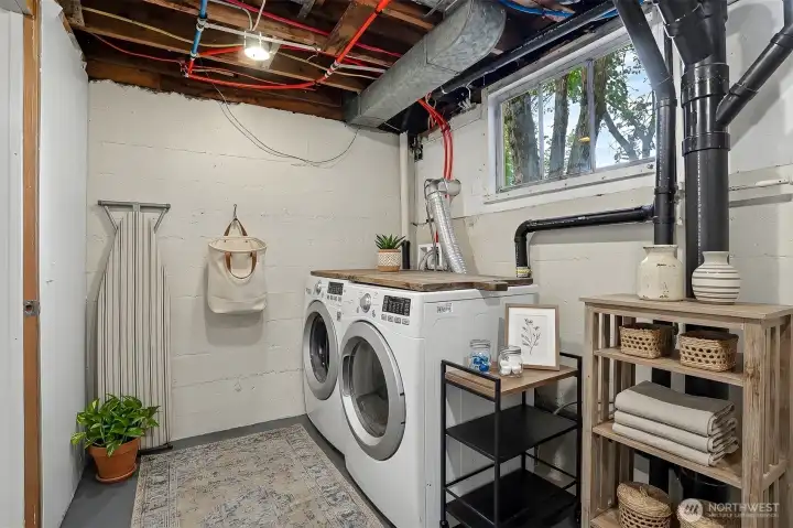 Laundry room on the lower level.  Also virtually staged.