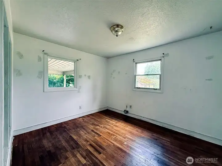 Second bedroom with hardwood floors and builtin storage Second bedroom with hardwood floors and builtin storage