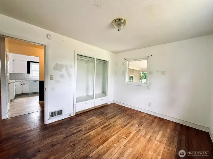 Second bedroom with hardwood floors and builtin storage Second bedroom with hardwood floors and builtin storage