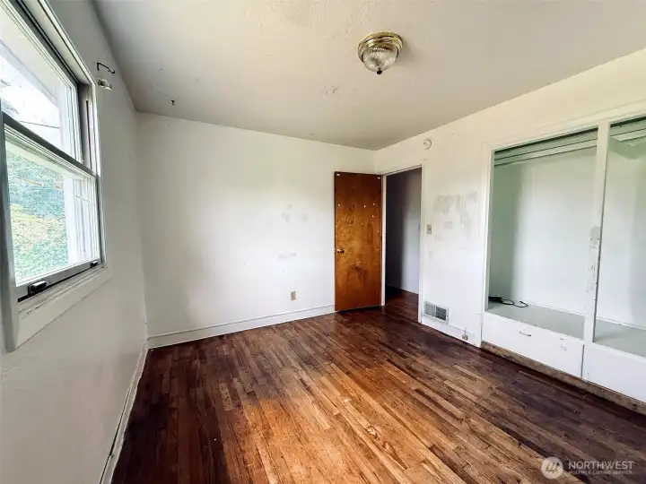 Third bedroom, hardwood floors and builtin storage Third bedroom, hardwood floors and builtin storage