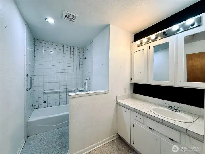 Main floor full bathroom with oversized vanity Main floor full bathroom with oversized vanity