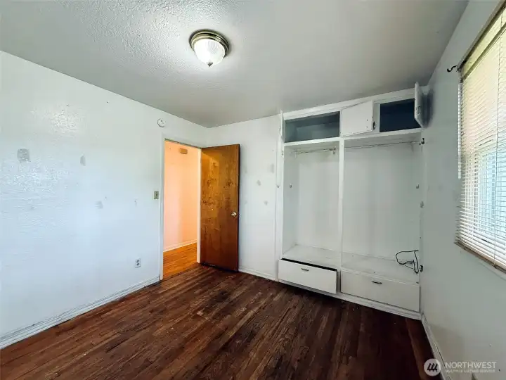 Second bedroom with built in storage and hardwood floors Second bedroom with built in storage and hardwood floors