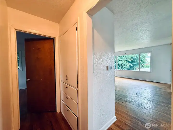 Hallway built in storage with generous access to living room Hallway built in storage with generous access to living room
