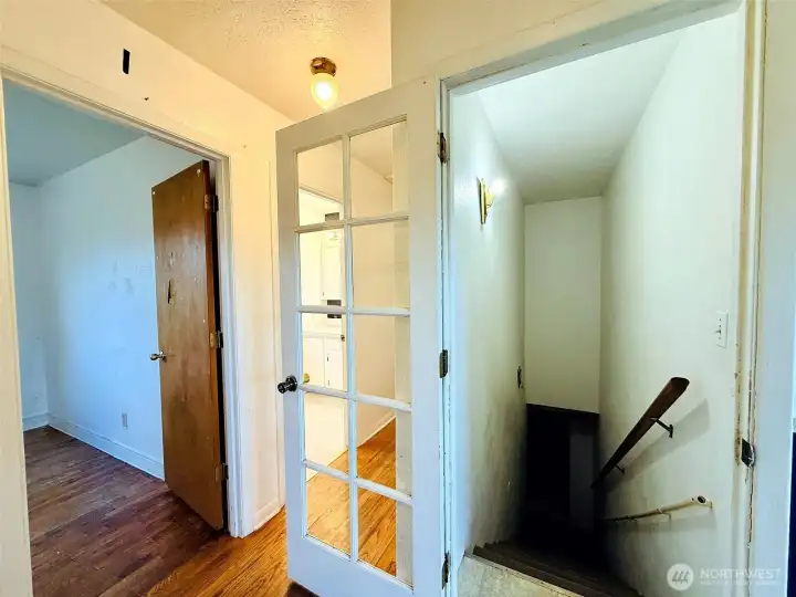 Main floor hallway and stairway to basement Main floor hallway and stairway to basement
