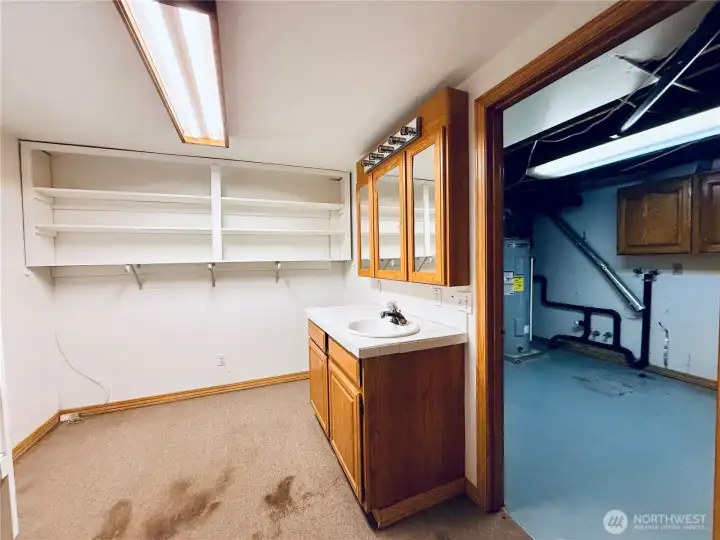 Basement bonus storage room with sink and vanity Basement bonus storage room with sink and vanity