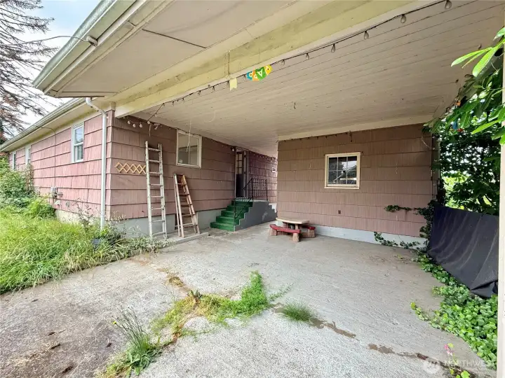 Covered patio behind detached garage Covered patio behind detached garage