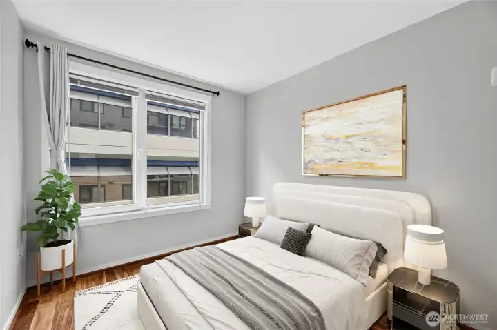 The bedroom features engineered wood floors and a spacious closet and is freshly painted. (Virtually staged.) The bedroom features engineered wood floors and a spacious closet and is freshly painted. (Virtually staged.)
