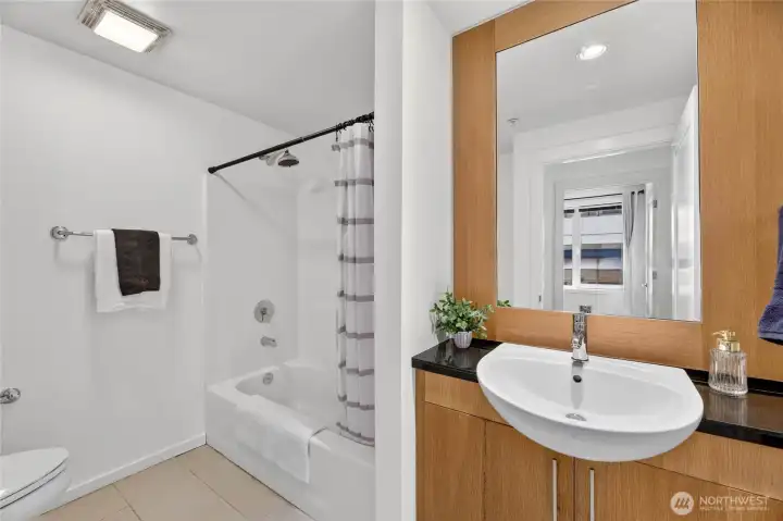 This spacious bathroom offers additional storage space just out of the LL frame. This spacious bathroom offers additional storage space just out of the LL frame.